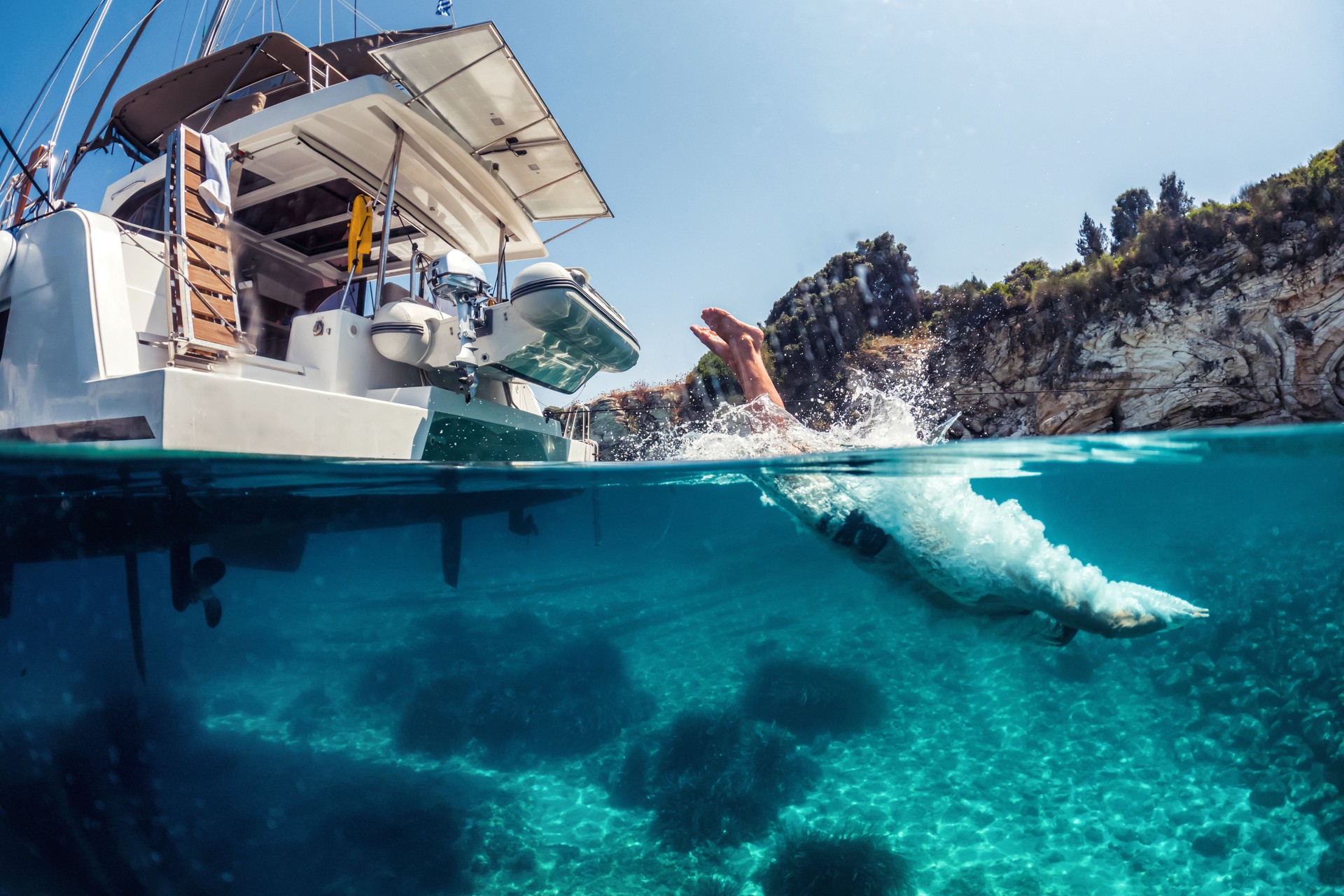 Underwater action shot of man breaking water surface